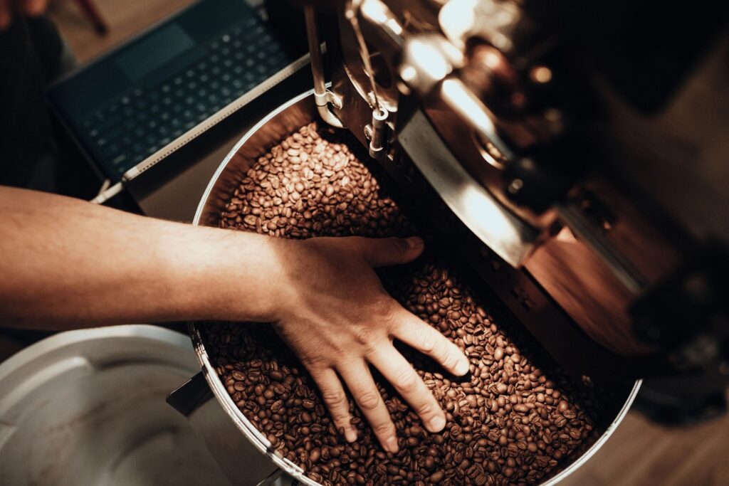 Cafe Owner Roasting Coffee For Small Business