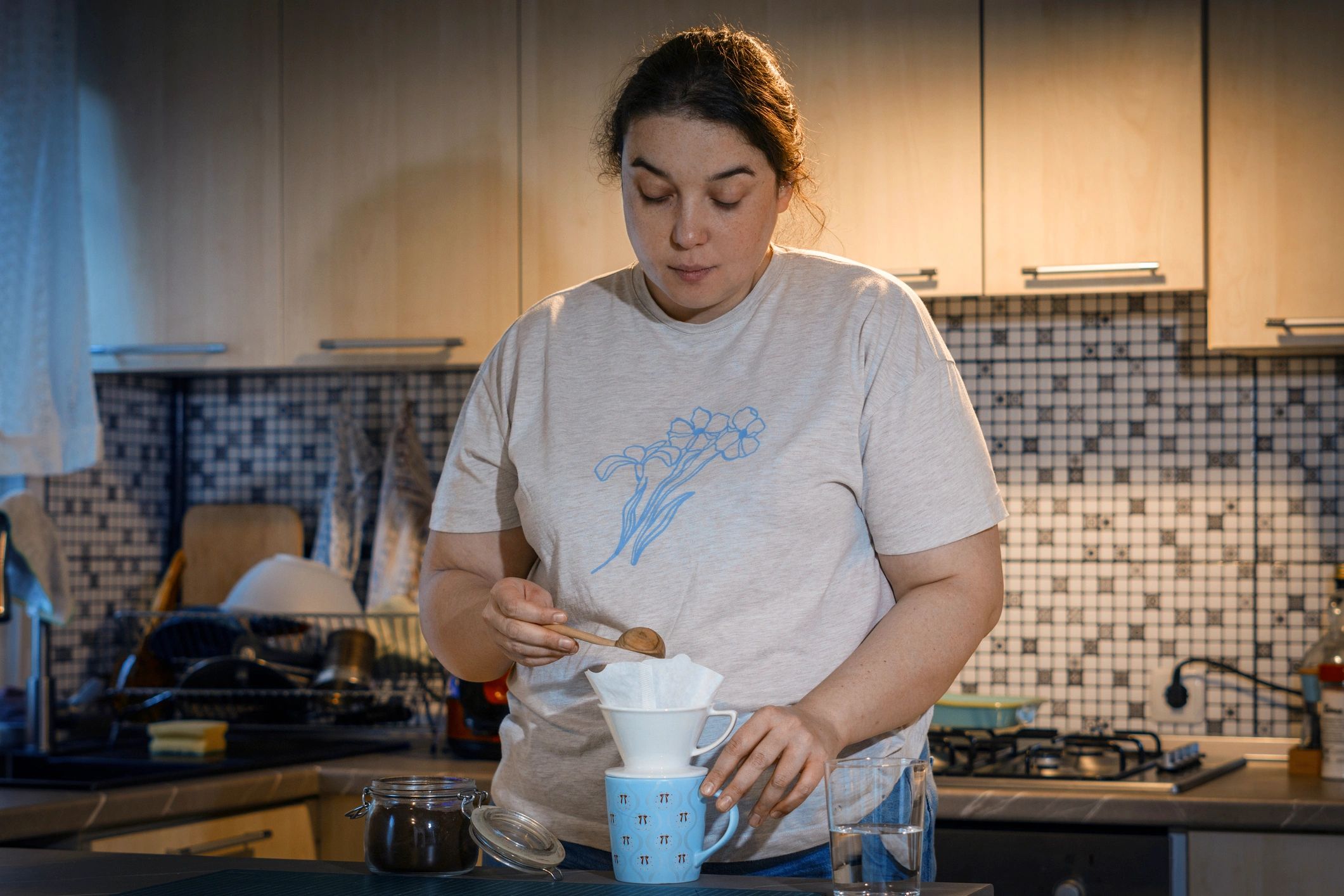 Customer making pour-over coffee at home